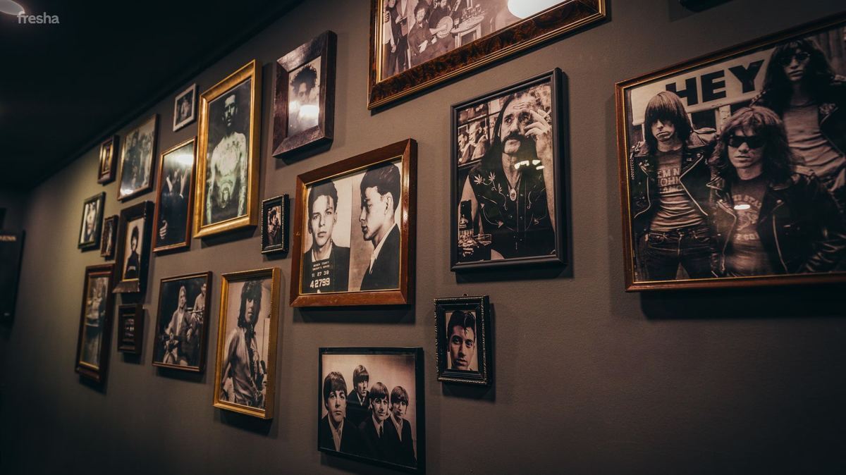 Photo wall inside The Blind Stag Barber Malta