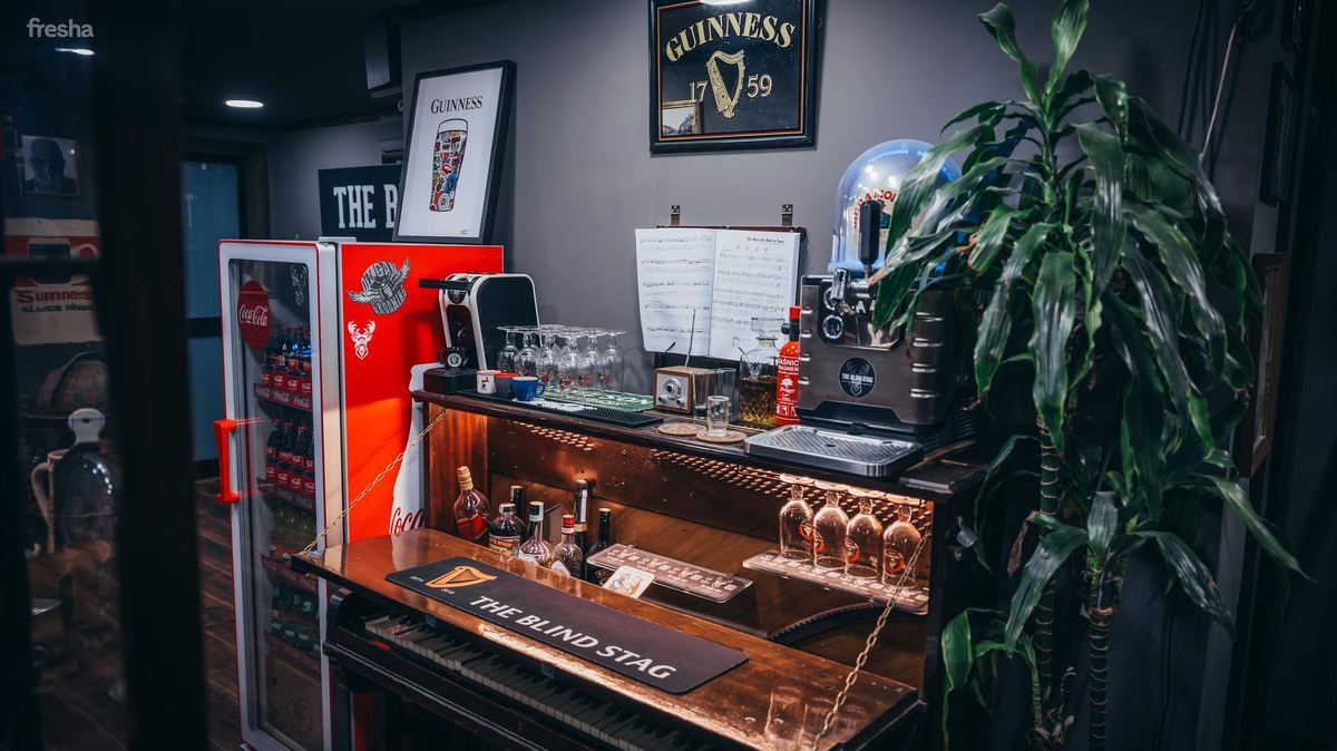 Speakeasy bar and drinks area at The Blind Stag Barber St Julian's