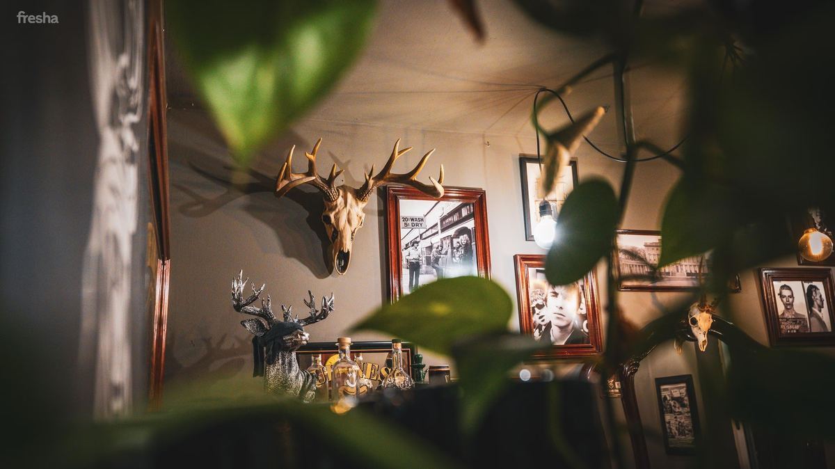Antlers and speakeasy decor at The Blind Stag Barber Malta