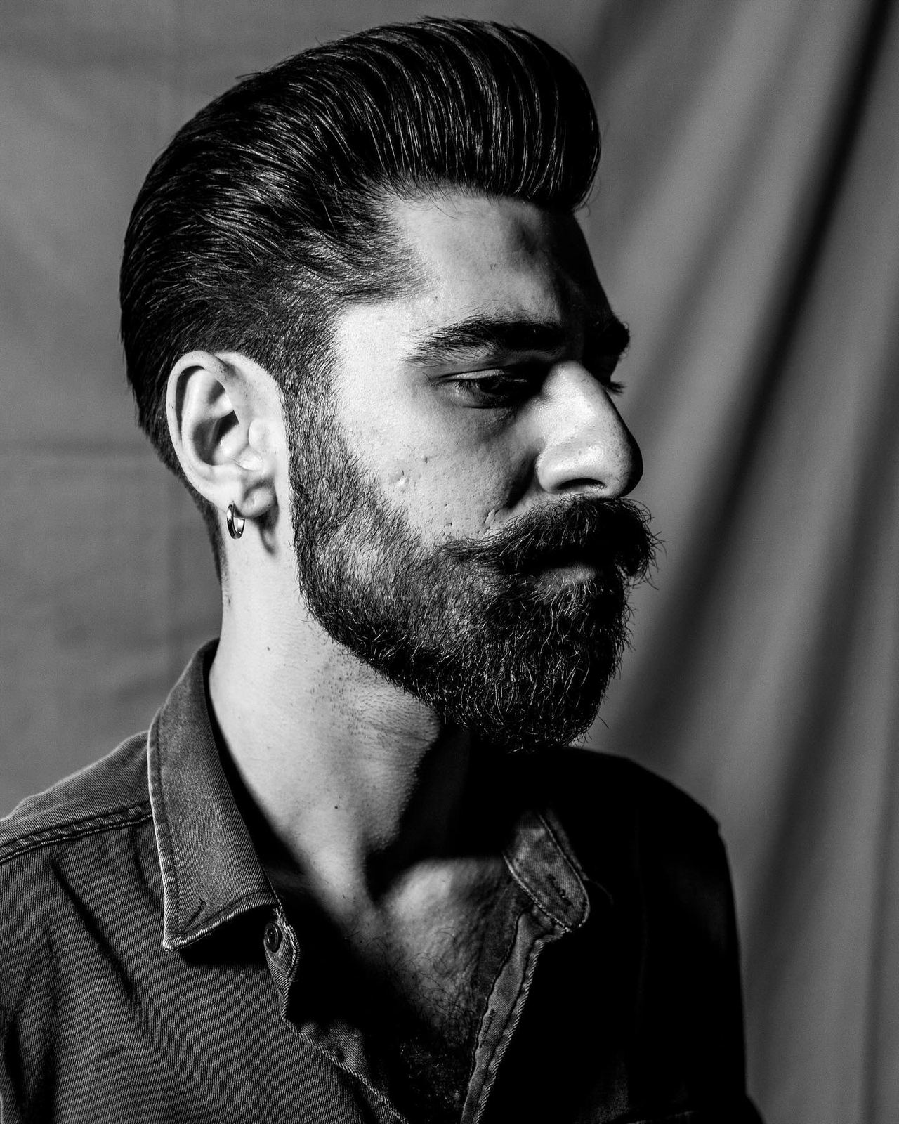 Modern pompadour haircut at The Blind Stag Barber